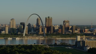 DX0001_000515 - 5.7K aerial stock footage of the Arch and city skyline along the Mississippi River, sunrise, Downtown St. Louis, Missouri