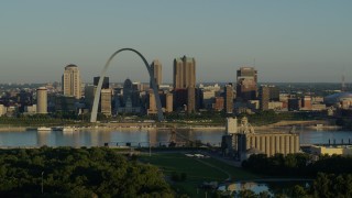 DX0001_000516 - 5.7K aerial stock footage of the skyline and Museum at the Gateway Arch along the Mississippi River, sunrise, Downtown St. Louis, Missouri