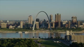 DX0001_000524 - 5.7K aerial stock footage approaching Mississippi River and Gateway Arch among skyline, sunrise, Downtown St. Louis, Missouri