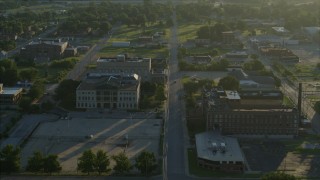DX0001_000525 - 5.7K aerial stock footage tracking a federal courthouse and medical center at sunrise, East St. Louis, Illinois