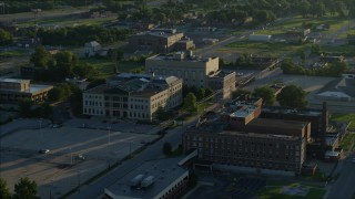 DX0001_000527 - 5.7K aerial stock footage circling a federal courthouse and hospital at sunrise, East St. Louis, Illinois