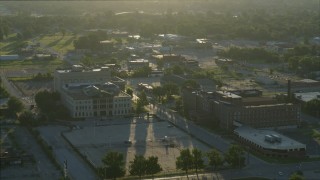 DX0001_000528 - 5.7K aerial stock footage orbit a medical center and a federal courthouse, sunrise, East St. Louis, Illinois