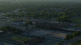 DX0001_000529 - 5.7K aerial stock footage orbiting a medical center and federal courthouse at sunrise, East St. Louis, Illinois