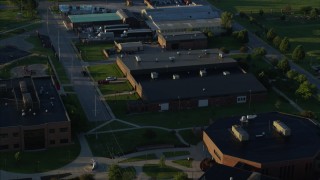 DX0001_000530 - 5.7K aerial stock footage approach and fly over a community college, sunrise, East St. Louis, Illinois
