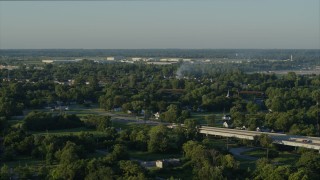 DX0001_000533 - 5.7K aerial stock footage descending from a view of a residential fire, sunrise, East St. Louis, Illinois