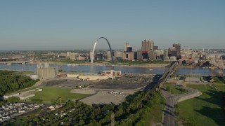 DX0001_000538 - 5.7K aerial stock footage of Gateway Arch and skyline from East St. Louis, sunrise, Downtown St. Louis, Missouri