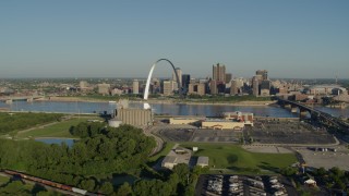 DX0001_000539 - 5.7K aerial stock footage of the Arch and skyline seen from across the Mississippi River, sunrise, Downtown St. Louis, Missouri