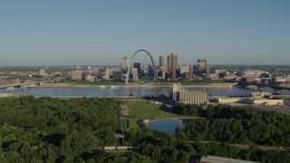 DX0001_000553 - 5.7K aerial stock footage of a park along the river and skyline and Arch, sunrise, Downtown St. Louis, Missouri