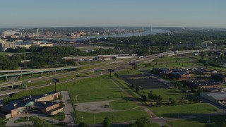 DX0001_000563 - 5.7K aerial stock footage flying over residential area toward interstates and mental hospital, sunrise, East St Louis, Illinois