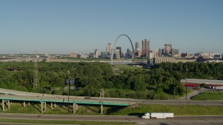 DX0001_000565 - 5.7K aerial stock footage descending below freeways with skyline and Arch in the distance, Downtown St. Louis, Missouri