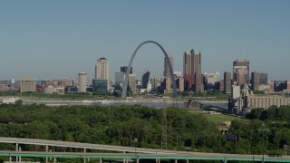 DX0001_000569 - 5.7K aerial stock footage of ascending from freeway, park and the Arch and skyline, Downtown St. Louis, Missouri