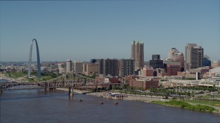 DX0001_000592 - 5.7K aerial stock footage approaching riverfront office buildings near a bridge with Arch in the background, Downtown St. Louis, Missouri