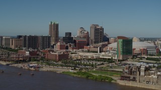 DX0001_000598 - 5.7K aerial stock footage of approaching Downtown St. Louis, Missouri skyscrapers and hotels while crossing the Mississippi River