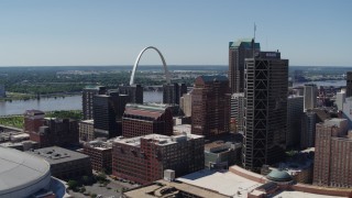 DX0001_000621 - 5.7K aerial stock footage of the Gateway Arch behind office buildings in Downtown St. Louis, Missouri
