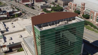 DX0001_000637 - 5.7K aerial stock footage orbit the Four Seasons Hotel, tilt to reveal Gateway Arch, Downtown St. Louis, Missouri