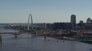 DX0001_000656 - 5.7K aerial stock footage of the famous Arch behind the bridge in Downtown St. Louis, Missouri