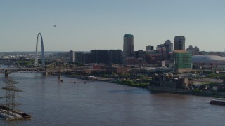 DX0001_000661 - 5.7K aerial stock footage flying over the river to approach hotels and Downtown St. Louis, Missouri