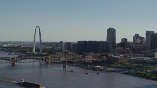 DX0001_000665 - 5.7K aerial stock footage reverse view of the Gateway Arch, Martin Luther King Bridge and Downtown St. Louis, Missouri