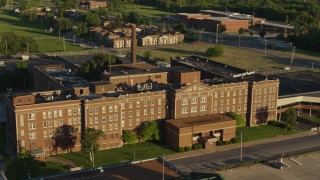 DX0001_000681 - 5.7K aerial stock footage of an abandoned hospital at sunset in East St. Louis, Illinois