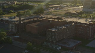 DX0001_000682 - 5.7K aerial stock footage orbit abandoned hospital at sunset in East St. Louis, Illinois