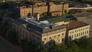 DX0001_000687 - 5.7K aerial stock footage of circling a federal courthouse at sunset in East St. Louis, Illinois