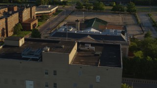 DX0001_000688 - 5.7K aerial stock footage orbit a federal courthouse and office building at sunset in East St. Louis, Illinois