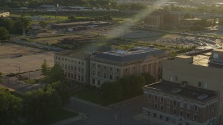 DX0001_000689 - 5.7K aerial stock footage of an orbit of a federal courthouse at sunset, East St. Louis, Illinois