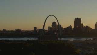 DX0001_000699 - 5.7K aerial stock footage of a view across the river at Gateway Arch and Downtown St. Louis, Missouri at sunset