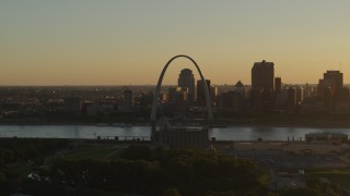 DX0001_000705 - 5.7K aerial stock footage of the Gateway Arch at sunset, across the river in Downtown St. Louis, Missouri