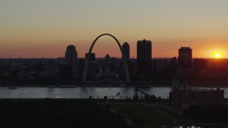 DX0001_000733 - 5.7K aerial stock footage of the Downtown St. Louis, Missouri skyline in silhouette at sunset