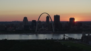 DX0001_000739 - 5.7K stock footage aerial video slow flyby of Gateway Arch and Downtown St. Louis, Missouri, sunset