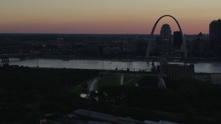 DX0001_000742 - 5.7K aerial stock footage the Gateway Geyser and Gateway Arch at sunset, Downtown St. Louis, Missouri, twilight