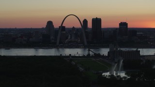 DX0001_000743 - 5.7K aerial stock footage the Downtown St. Louis, Missouri, skyline seen from Gateway Geyser at twilight