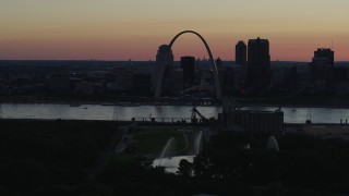 DX0001_000746 - 5.7K aerial stock footage of a stationary and flyby view of the Gateway Arch in Downtown St. Louis, Missouri, twilight