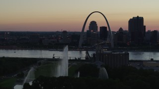 DX0001_000750 - 5.7K aerial stock footage water from Gateway Geyser and the Gateway Arch, Downtown St. Louis, Missouri, twilight