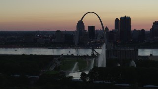 DX0001_000751 - 5.7K aerial stock footage reverse view of Gateway Geyser and Arch, Downtown St. Louis, Missouri, twilight