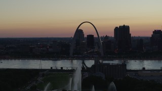 DX0001_000755 - 5.7K aerial stock footage of a stationary view of the Gateway Geyser, and the Arch in Downtown St. Louis, Missouri, twilight