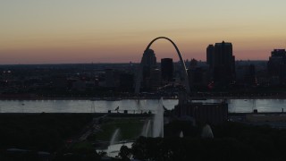 DX0001_000756 - 5.7K aerial stock footage a reverse view of the Gateway Geyser, and the Arch in Downtown St. Louis, Missouri, twilight