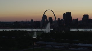 DX0001_000757 - 5.7K aerial stock footage a static view of the Gateway Geyser, and the Arch in Downtown St. Louis, Missouri, twilight