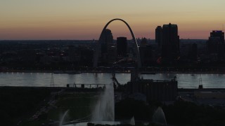 DX0001_000758 - 5.7K aerial stock footage ascend over the Gateway Geyser for view of the Arch in Downtown St. Louis, Missouri, twilight
