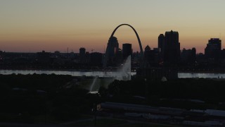 DX0001_000759 - 5.7K aerial stock footage fly way from Gateway Arch in Downtown St. Louis, Missouri, twilight, and the Gateway Geyser