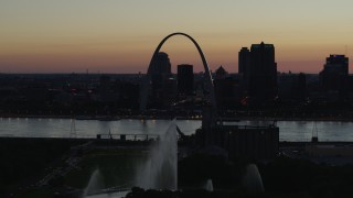 DX0001_000761 - 5.7K aerial stock footage approach Gateway Geyser and the Arch across the river, Downtown St. Louis, Missouri, twilight