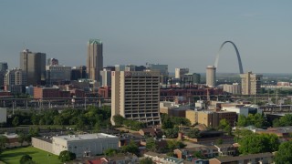 DX0001_000813 - 5.7K aerial stock footage of passing an office building with the Gateway Arch in background, Downtown St. Louis, Missouri
