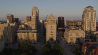 DX0001_000846 - 5.7K aerial stock footage of courthouses seen while descending at sunset, Downtown St. Louis, Missouri