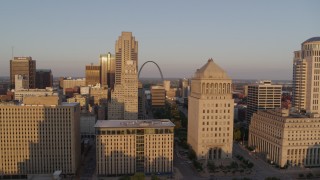 DX0001_000850 - 5.7K aerial stock footage flyby courthouse and office buildings to reveal Arch at sunset, Downtown St. Louis, Missouri