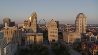 DX0001_000853 - 5.7K aerial stock footage of the Gateway Arch and museum seen from courthouses at sunset, Downtown St. Louis, Missouri