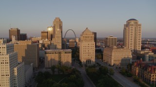 DX0001_000855 - 5.7K aerial stock footage approach courthouses with view of the Gateway Arch at sunset, Downtown St. Louis, Missouri