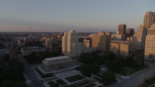 DX0001_000858 - 5.7K aerial stock footage fly over museum to approach a tall apartment building at sunset, Downtown St. Louis, Missouri