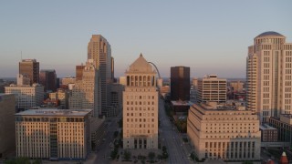 DX0001_000862 - 5.7K aerial stock footage approach downtown courthouse and ascend to reveal Arch at sunset, Downtown St. Louis, Missouri