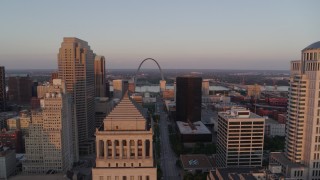 DX0001_000867 - 5.7K aerial stock footage approach a courthouse and rise to reveal Arch and museum at sunset, Downtown St. Louis, Missouri